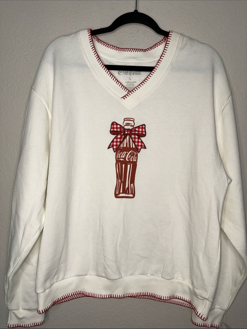 Coca Cola Cream V-Neck Sweatshirt with Red Bottle Graphic